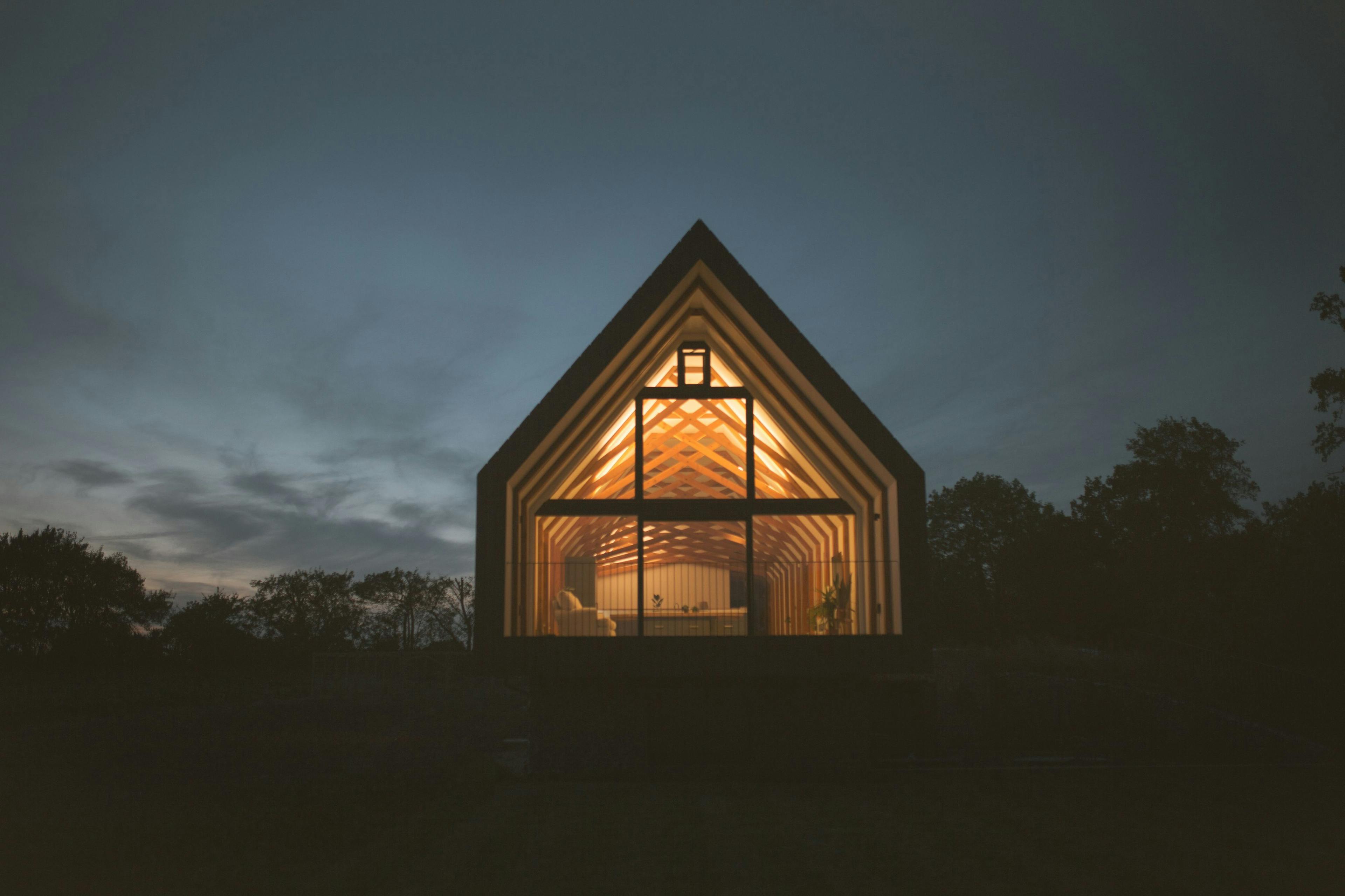 Isolated home in the countryside lit up at night