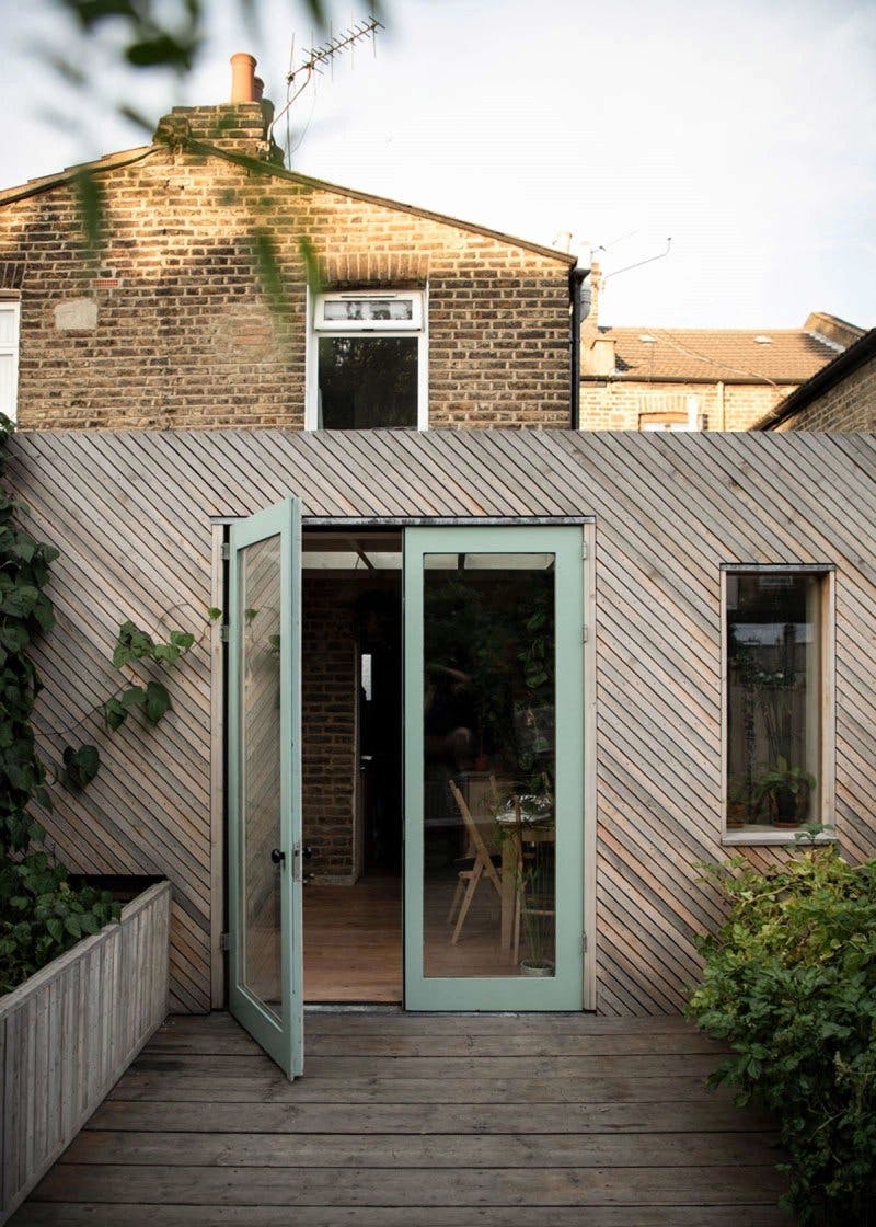 Exterior view of timber clad contemporary extension by Studio Bark