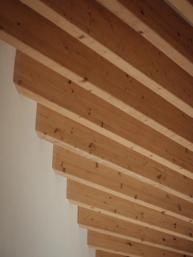 Contemporary exposed timber beams by Studio Bark