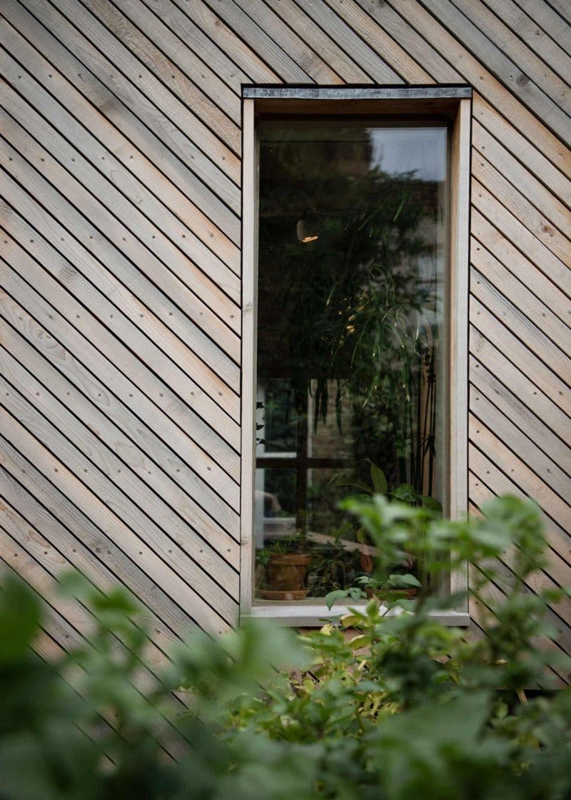 Exterior view of kitchen window with timber cladding