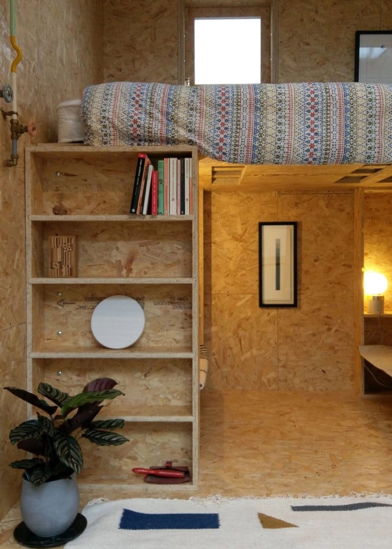 Combined shelving and staircase at the SHED project tiny home