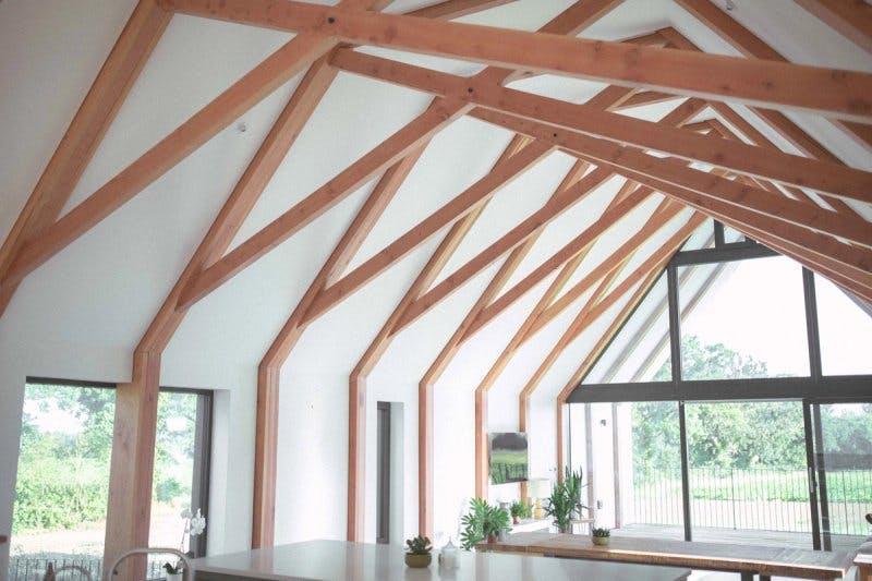 Timber trusses form the structure of Black Barn