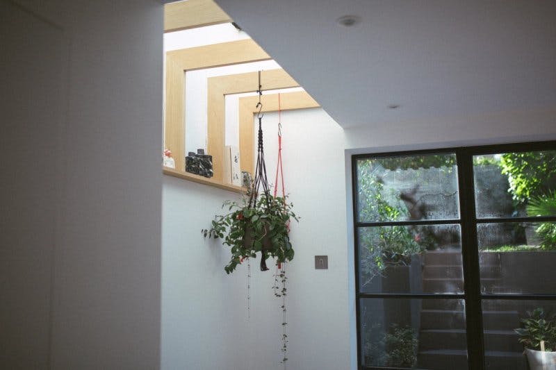 Details provide storage and expose daylight to the interior