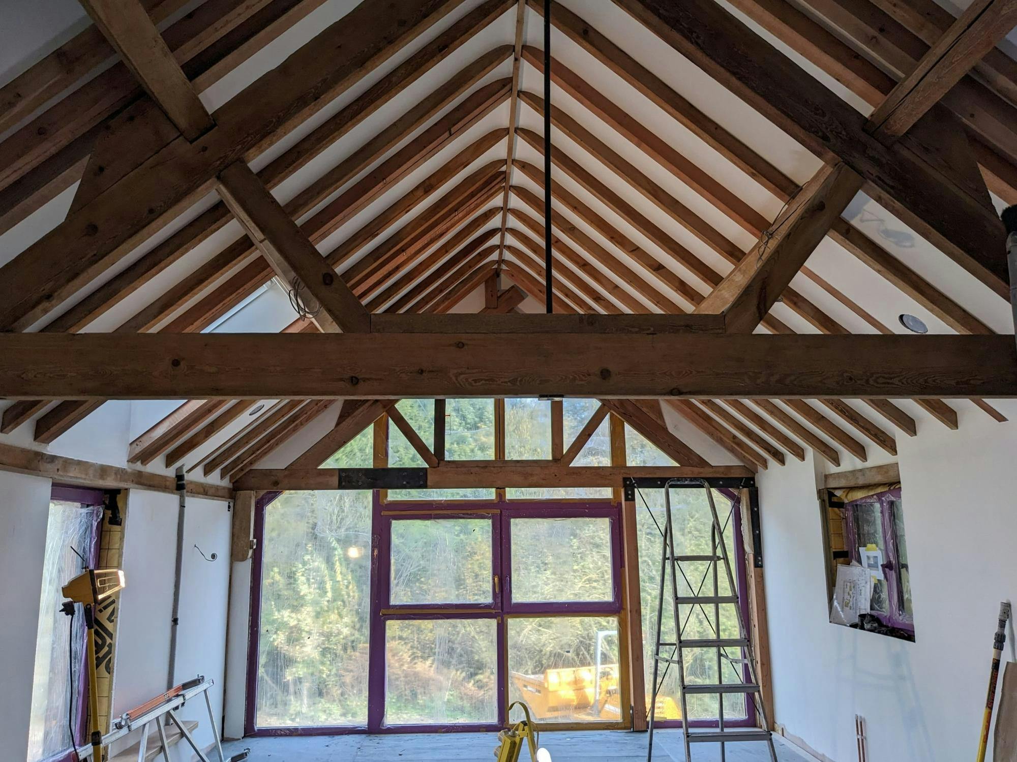 Internal view of timber rafters of the Shropshire Farm with white ceiling and walls